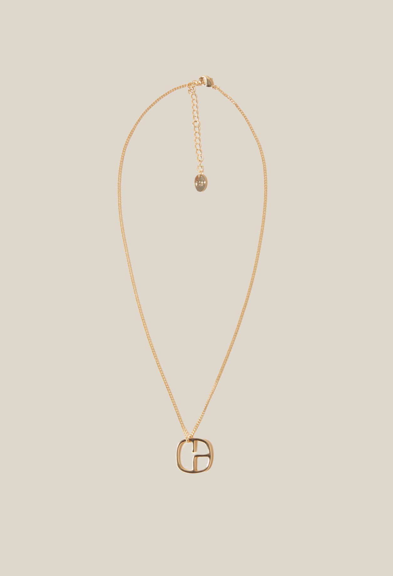 Collier pendentif monogramme doré