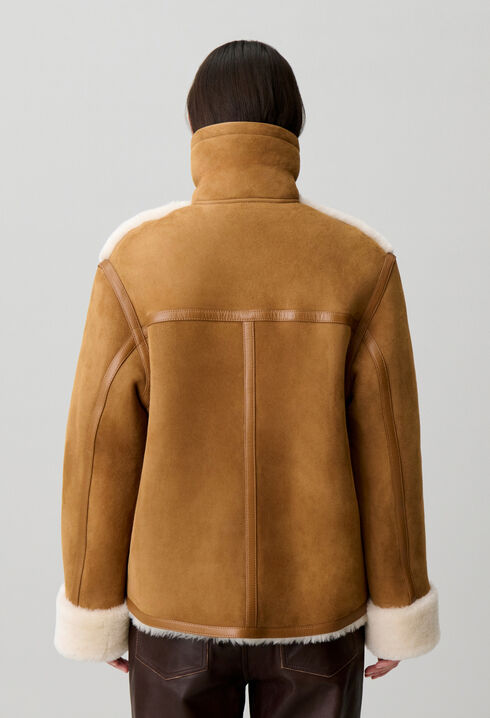 Veste peau lain&eacute;e col cuir